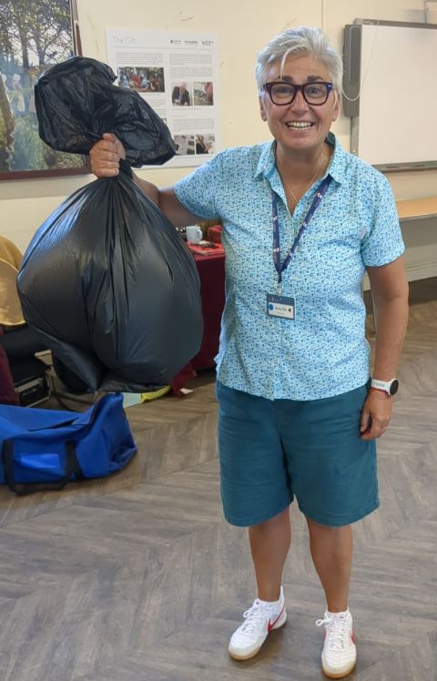 Dotty Ellis Holding a bag of rubbish